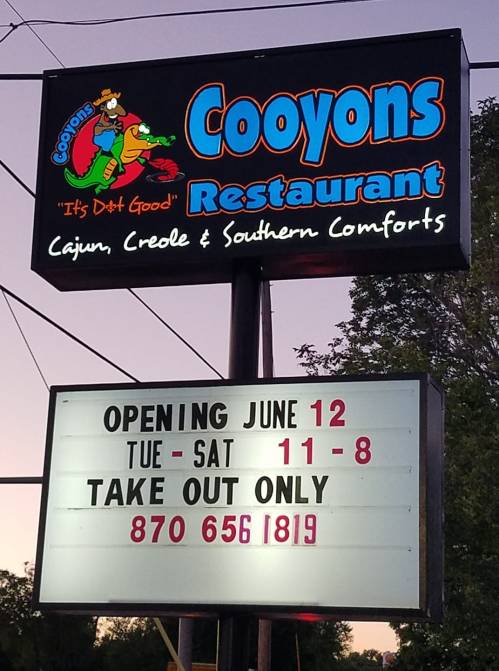 Sign for Cooyons Restaurant, featuring "Opening June 12" and "Take Out Only" with hours listed.
