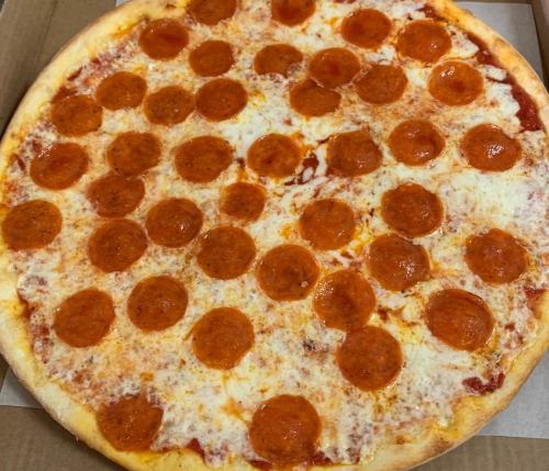 A large pizza topped with a generous layer of pepperoni slices on melted cheese and tomato sauce.