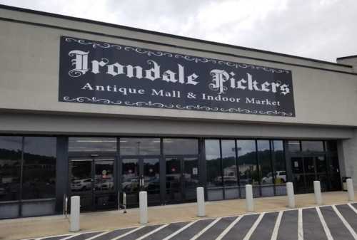 Exterior of Irondale Pickers Antique Mall & Indoor Market, featuring a large sign and parking area.