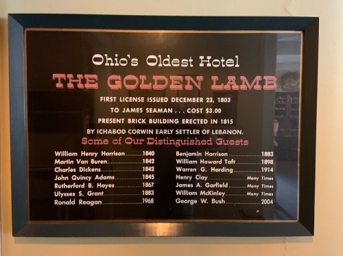 Plaque listing notable guests of Ohio's oldest hotel, The Golden Lamb, with names and years of their stays.