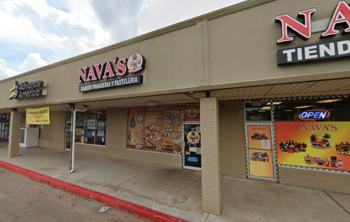 Exterior of a storefront labeled "Nava's" with colorful signage, located in a shopping plaza.