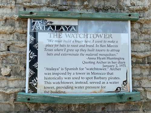 Sign about Atalaya, a watchtower in San Marcos, Texas, detailing its history and purpose for water and pest control.