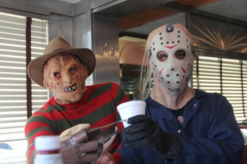 Two iconic horror characters in masks, one with a striped sweater and clawed glove, the other in a hockey mask, holding a cup.