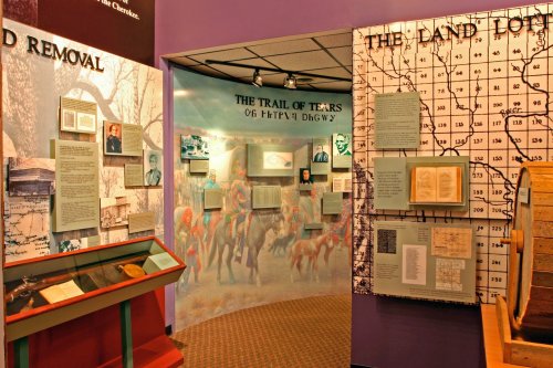 Exhibit on the Trail of Tears, featuring historical images, documents, and artifacts related to Native American removal.