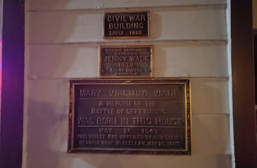 Plaques on a wall commemorating the Civil War Building and Mary Virginia Wade, a heroine of the Battle of Gettysburg.