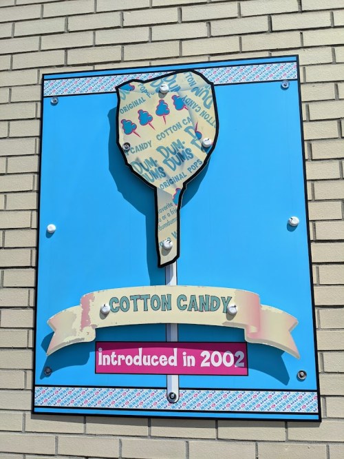 Sign featuring a large cotton candy illustration, with text stating "Cotton Candy introduced in 2002."