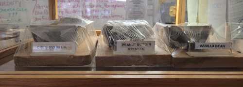 Display case with three types of fudge: Oreo, Peanut Butter, and Vanilla Bean, each labeled with prices.
