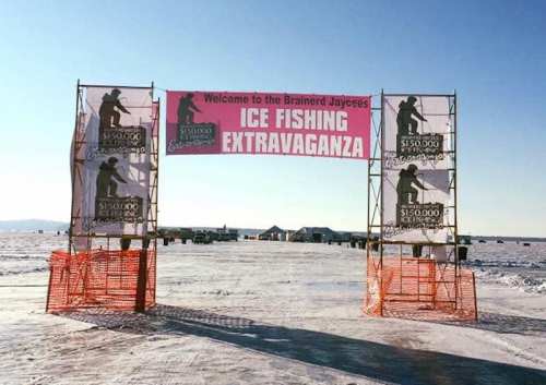 A large banner welcomes visitors to the Brainerd Jaycees Ice Fishing Extravaganza, set on a snowy ice landscape.