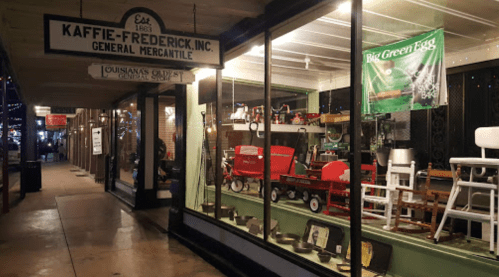 A storefront with a sign reading "Kaffie-Frederick, Inc." showcasing various merchandise and festive decorations.