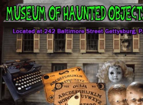 Image of a haunted objects museum with a spooky house backdrop, featuring a typewriter, Ouija board, and eerie dolls.