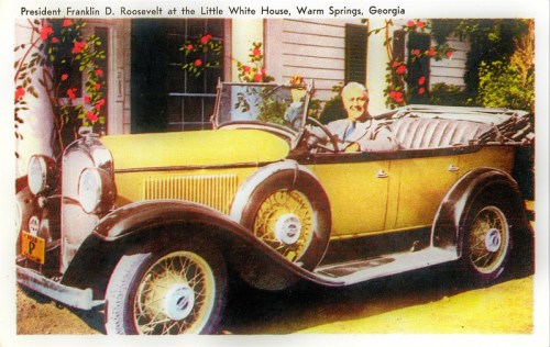 President Franklin D. Roosevelt sits in a vintage convertible outside the Little White House in Warm Springs, Georgia.