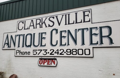 Sign for Clarksville Antique Center, featuring the phone number and an "Open" indicator.