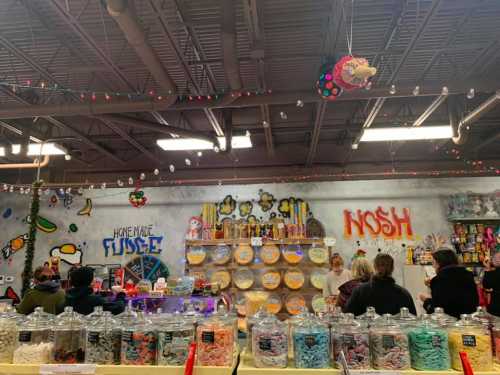 A colorful candy shop with jars of sweets, festive decorations, and customers enjoying the vibrant atmosphere.