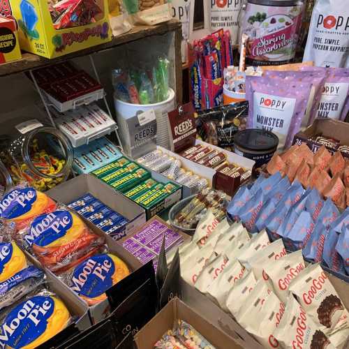 A colorful display of various snacks and candies, including Moon Pies, popcorn, and assorted sweets in a store.