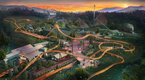 A vibrant amusement park scene at sunset, featuring roller coasters, attractions, and visitors enjoying the rides.