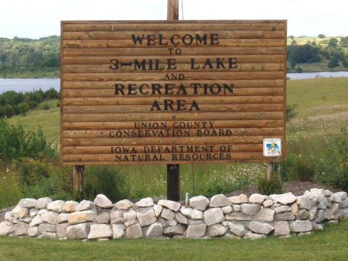 Wooden sign welcoming visitors to 3-Mile Lake Recreation Area, Union County Conservation Board, Iowa Department of Natural Resources.