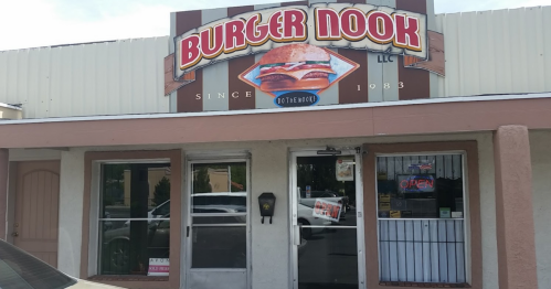 Sign for Burger Nook, a casual eatery, featuring a burger graphic and "Since 1983" above the entrance.