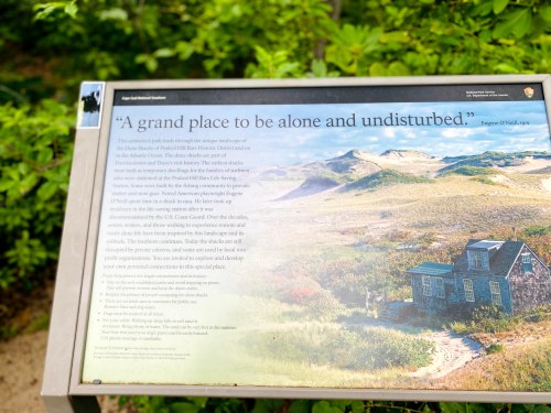 Sign describing the unique landscape of Cape Cod National Seashore, emphasizing solitude and natural beauty.