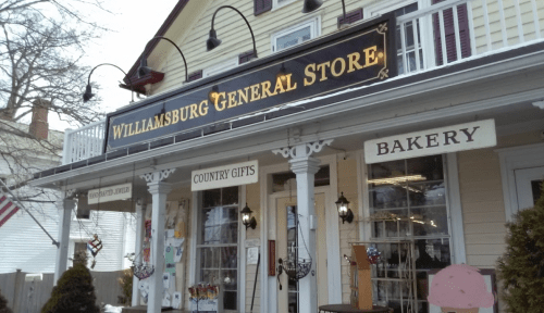 Exterior of the Williamsburg General Store, featuring signs for "Country Gifts" and "Bakery" under a charming porch.