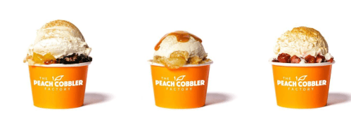 Three dessert cups from The Peach Cobbler Factory, each topped with ice cream and different fruit toppings.