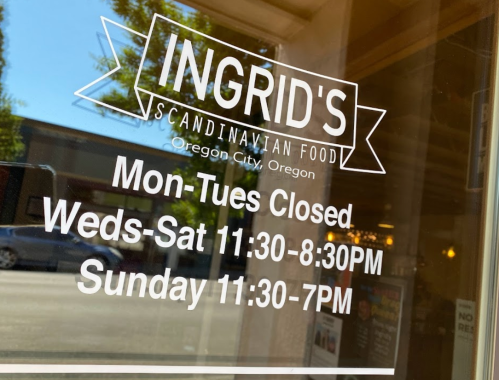 Sign for Ingrid's Scandinavian Food in Oregon City, listing hours: Mon-Tues Closed, Weds-Sat 11:30-8:30, Sun 11:30-7.