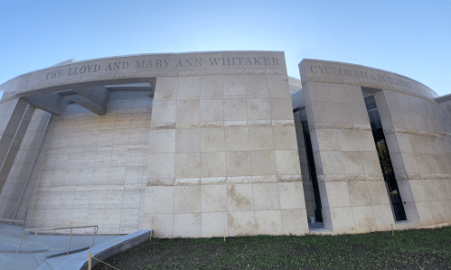 Exterior view of the Cyclorama Building, featuring the names "Lloyd and Mary Ann Whitaker" on the facade.