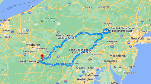 Map showing a route through Pennsylvania, highlighting Laurel Caverns, Penn's Cave, and Pinchot State Forest.