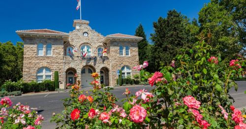 Sonoma City Hall building with pink roses growing in the foreground