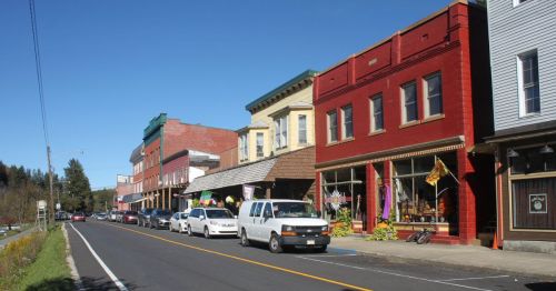 Side street of historic buildings in Thomas, West Virginia, on a sunny day