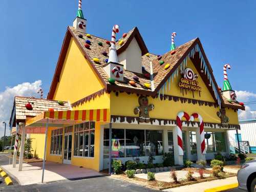 A colorful candy-themed building with a sloped roof, decorated with candy canes and gumdrops.