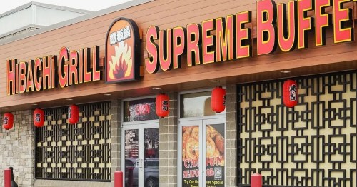 Exterior of Hibachi Grill Supreme Buffet, featuring bright signage and decorative lanterns.