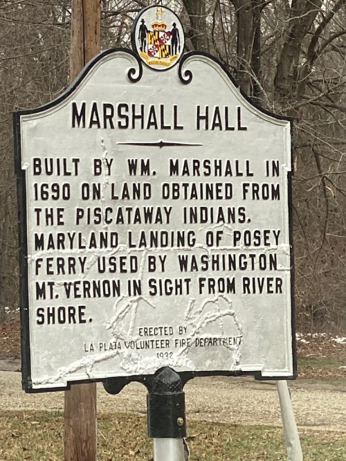 Historical marker for Marshall Hall, detailing its construction in 1690 and significance related to Washington and the Piscataway Indians.