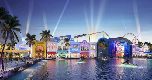 Colorful waterfront amusement park with shops, palm trees, and a roller coaster under a twilight sky.