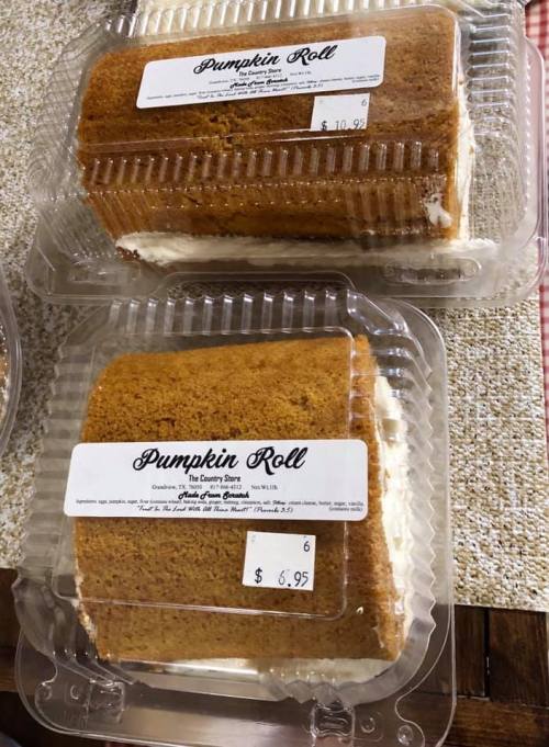 Two pumpkin rolls in clear plastic containers, labeled with prices of $6.95 and $10.95.