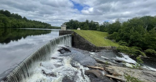 ponagansett falls, a manmade waterfall in clayville rhode island on a cloudy day