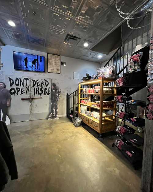 Interior of a shop featuring merchandise displays, a TV showing a scene, and a "Don't Dead Open Inside" sign.