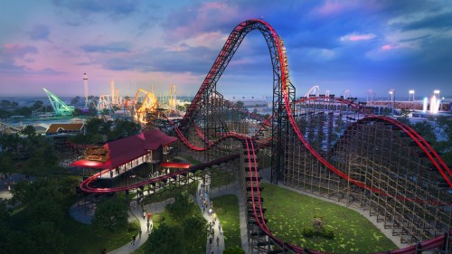 A vibrant amusement park scene featuring a towering roller coaster against a colorful sunset sky.