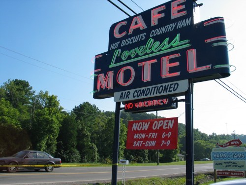 Neon sign for Loveless Cafe and Motel, featuring "Air Conditioned" and "No Vacancy" with operating hours listed.