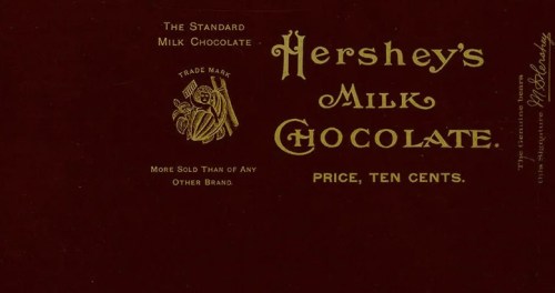 Vintage Hershey's Milk Chocolate wrapper featuring gold text on a dark background, priced at ten cents.