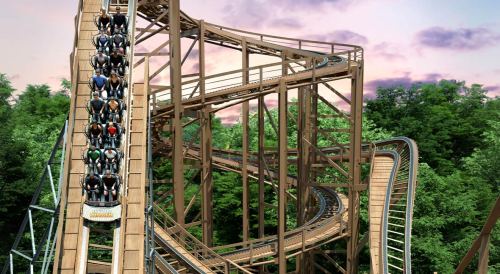 A wooden roller coaster with riders descending a steep drop, surrounded by lush green trees and a colorful sky.