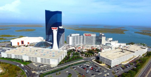 Aerial view of Harrah's Resort, featuring modern buildings and a waterfront landscape.