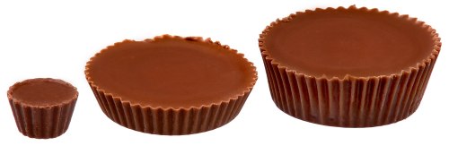 Three chocolate cups of varying sizes: a small, medium, and large, all with smooth, shiny chocolate tops.