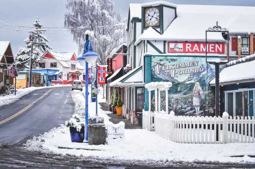 A snowy street scene featuring colorful buildings, a clock tower, and a ramen shop in a quaint town.