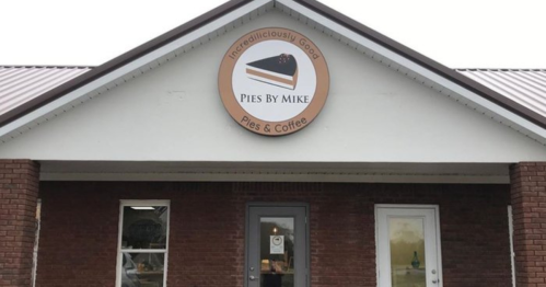 Exterior of "Pies By Mike" shop featuring a sign that reads "Incredibly Good Pies & Coffee" above the entrance.