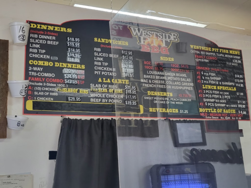 Menu board for Westside BBQ featuring dinner options, sandwiches, combo dinners, sides, and beverages.