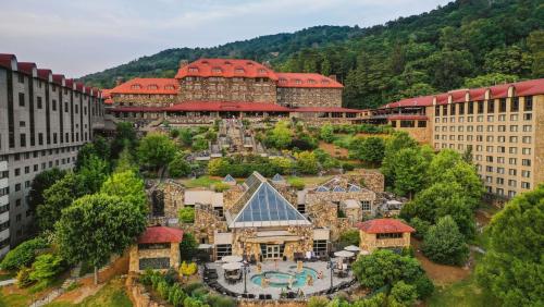 A scenic view of a large hotel complex surrounded by lush greenery and landscaped gardens.