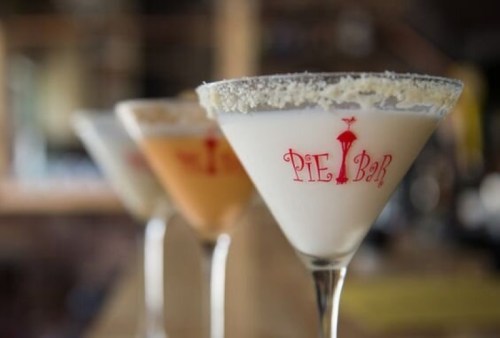 Three colorful cocktails in martini glasses, featuring a rim of sugar, with "PIE Bar" logo visible on the glasses.