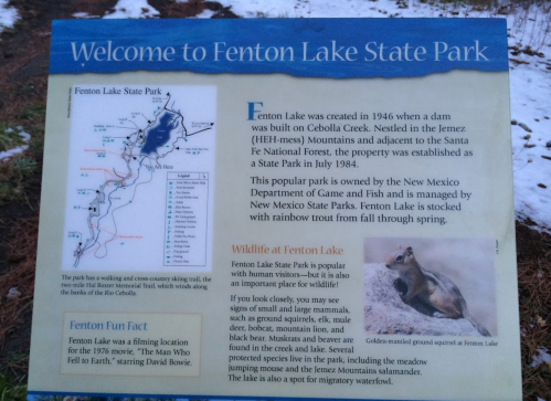 Sign welcoming visitors to Fenton Lake State Park, detailing its history, wildlife, and a fun fact about David Bowie.