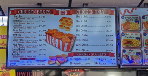 Menu board displaying chicken boxes, chicken only options, and chicken nuggets with prices listed.