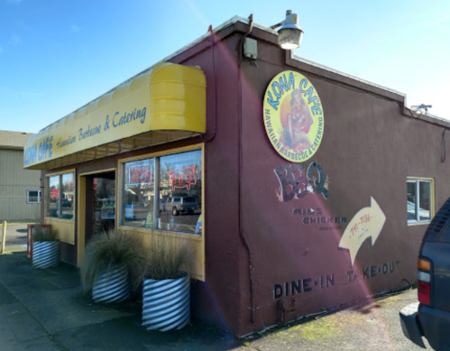 A colorful restaurant exterior with a sign for "Kona Cafe," featuring BBQ and takeout options.